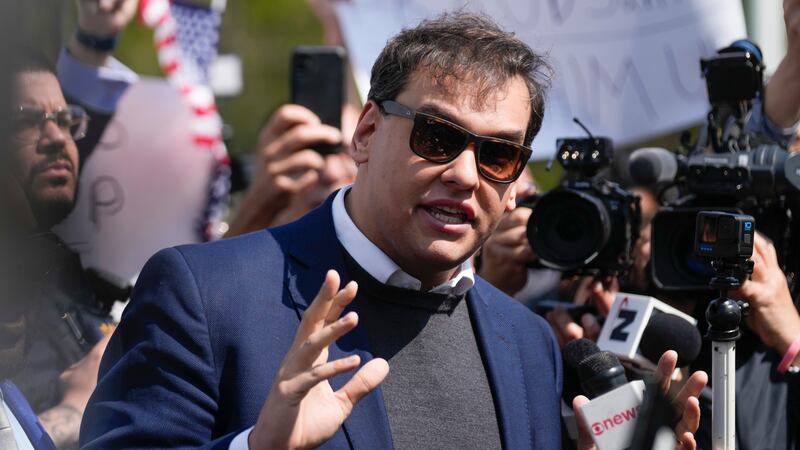 U.S. Rep. George Santos speaks to reporters outside of the federal courthouse in Central...