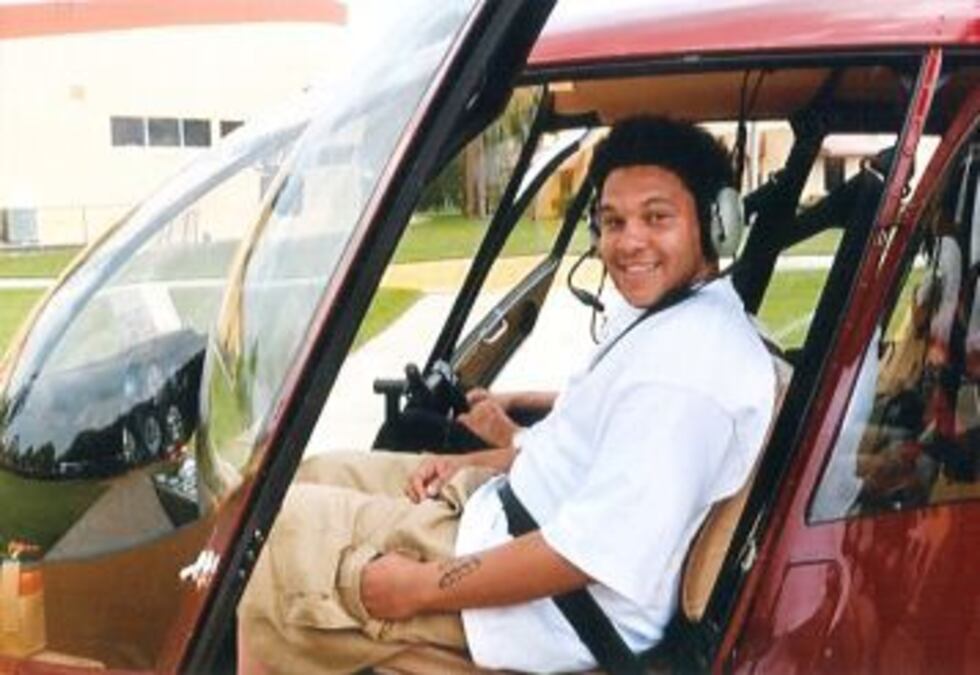 Charlie Artis, the owner of a local barber shop in Gunboat Plaza off Gunboat Drive in...