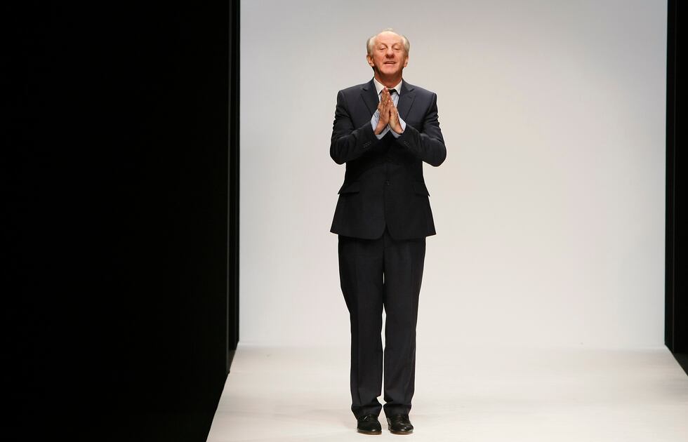 FILE - Designer Paul Costelloe reacts to the audience after his Autumn/Winter 2010 collection...