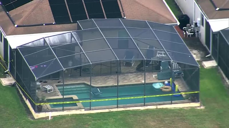 Authorities say a pair of 5-year-old twin sisters on vacation drowned in the pool at their...